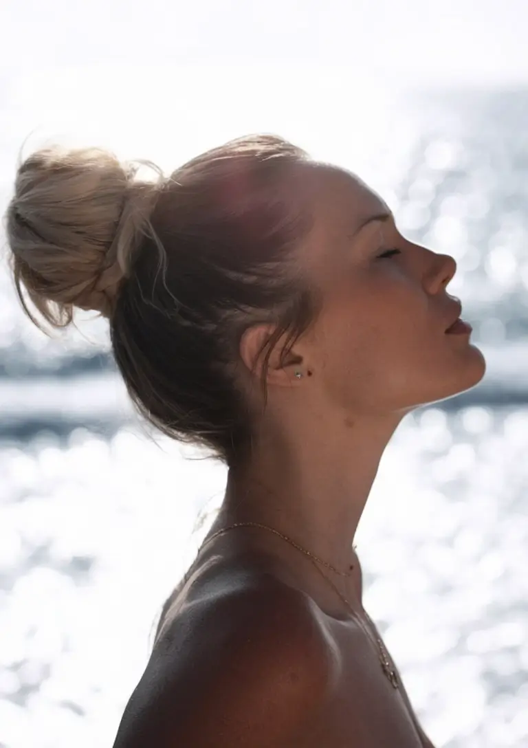Fresh Swimming Hairstyles for Summer 2025 Low Bun + Blonde Glow