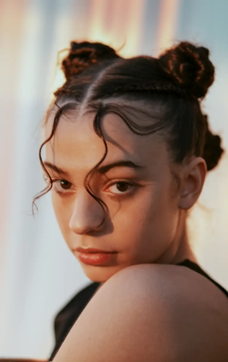 Fresh Swimming Hairstyles for Summer 2025 Playful Braided Space Buns